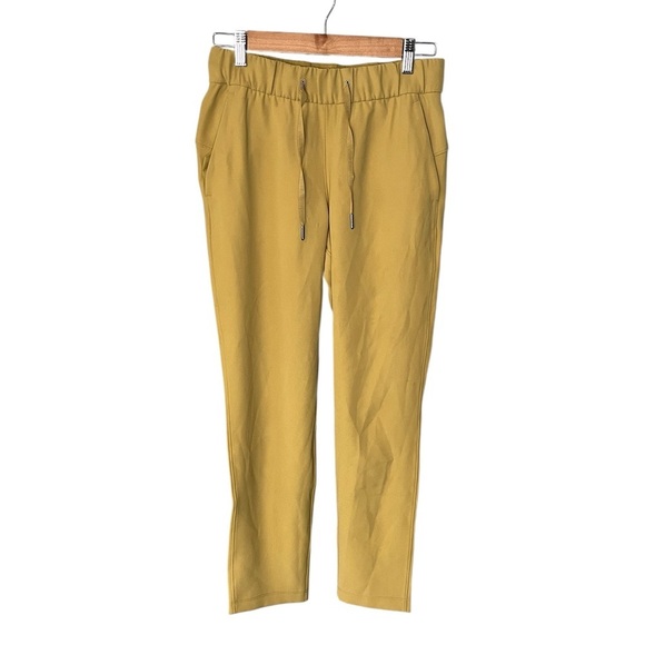 Lululemon On the Fly 7/8 Pant *Woven Vintage Gold - Picture 2 of 10
